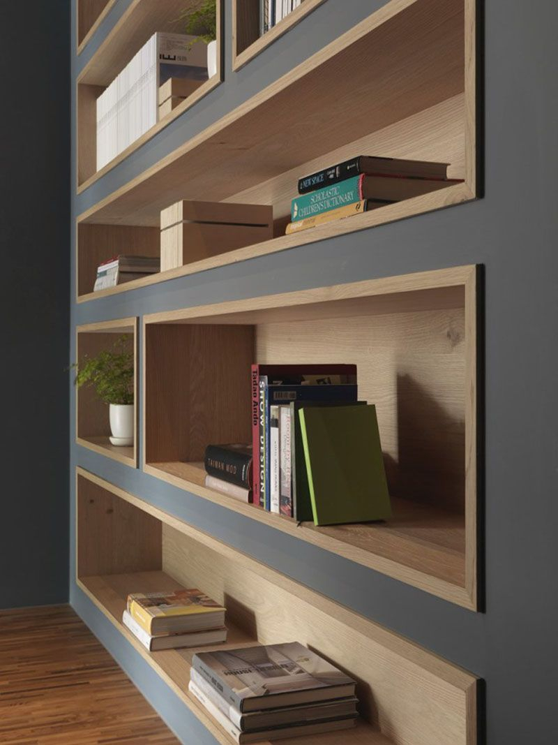 Built In Bookshelves Lined With Wood Highlight The Displayed with size 800 X 1067