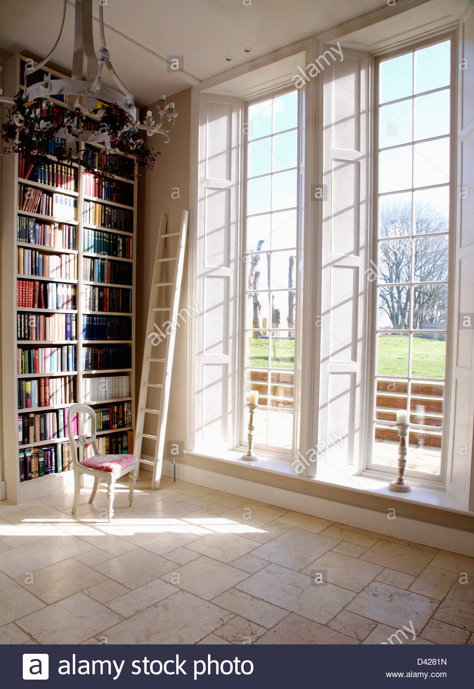 Floor To Ceiling Bookshelves And Tall Windows In White in sizing 957 X 1390